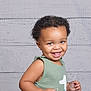 Cyrus joined the competition — help win amazing prizes! toddler, child, smiling, happy, green_outfit, number_one, curly_hair, portrait, studio, background, wooden_planks, cute, baby, person, indoor, face, eyes, skin, expression, joyful