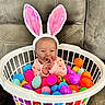 Braelynn joined the competition — help win amazing prizes! baby, bunny_ears, laundry_basket, plastic_eggs, colorful, pink_clothing, couch, indoor, cute, holiday, easter, toy, smiling, child, face, headwear, seated, celebration, playful, festive