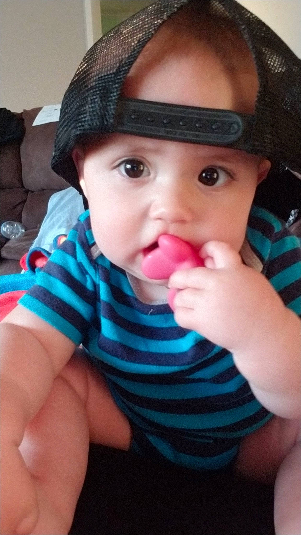 Forrest is registered to the contest to win money with this photo: baby, baby_toddler_clothing, cheek, cool, eye, eyelash, finger, hand, happy, hat, iris, lip, mouth, nail, nose, organ, person, pink, skin, thumb