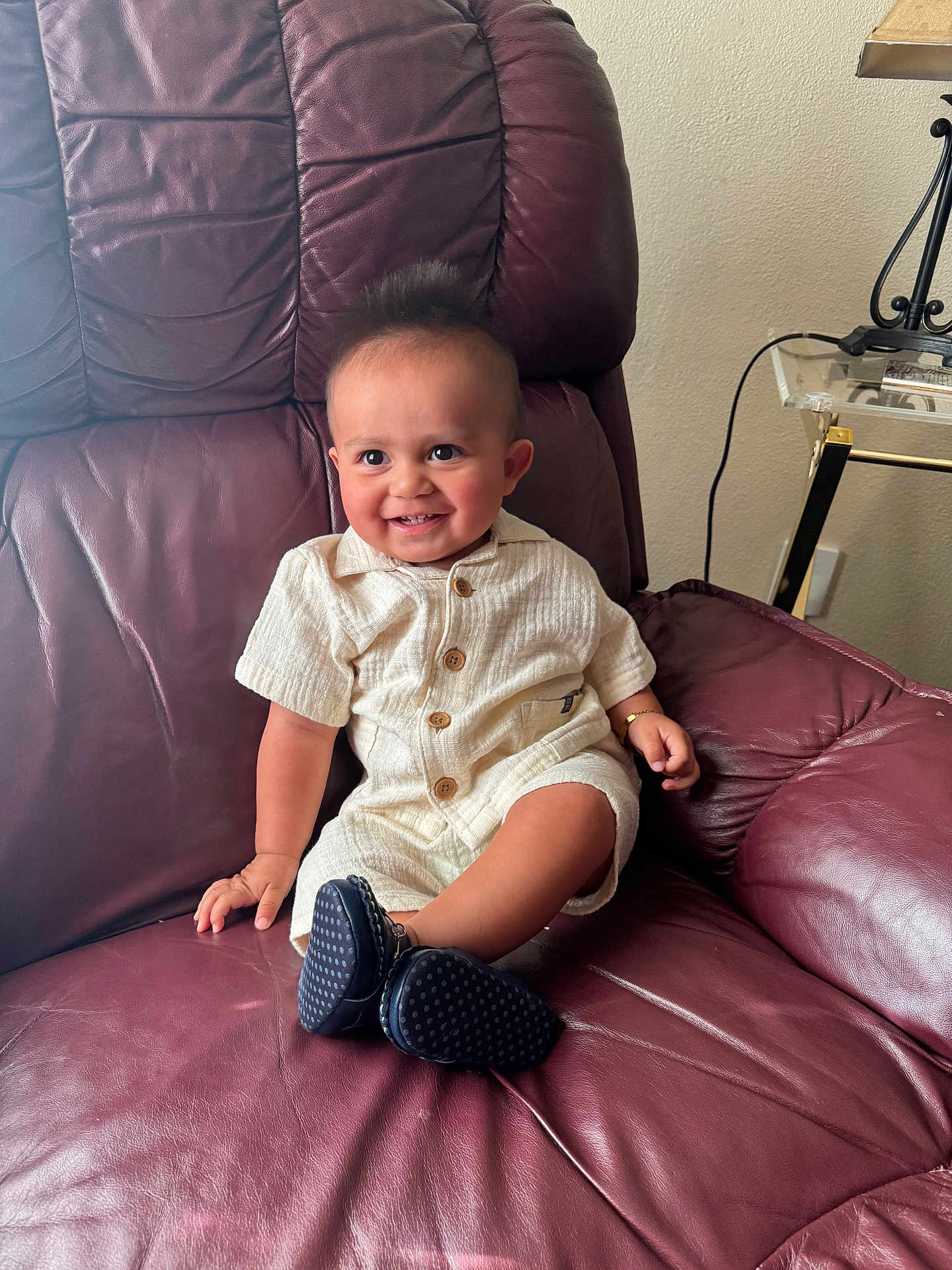Mark joined the competition — help win amazing prizes! baby, child, smile, leather_chair, maroon, cream_outfit, wooden_buttons, navy_shoes, indoor, happy, person, furniture, seat, cute, infant, sitting, human, portrait, candid, home