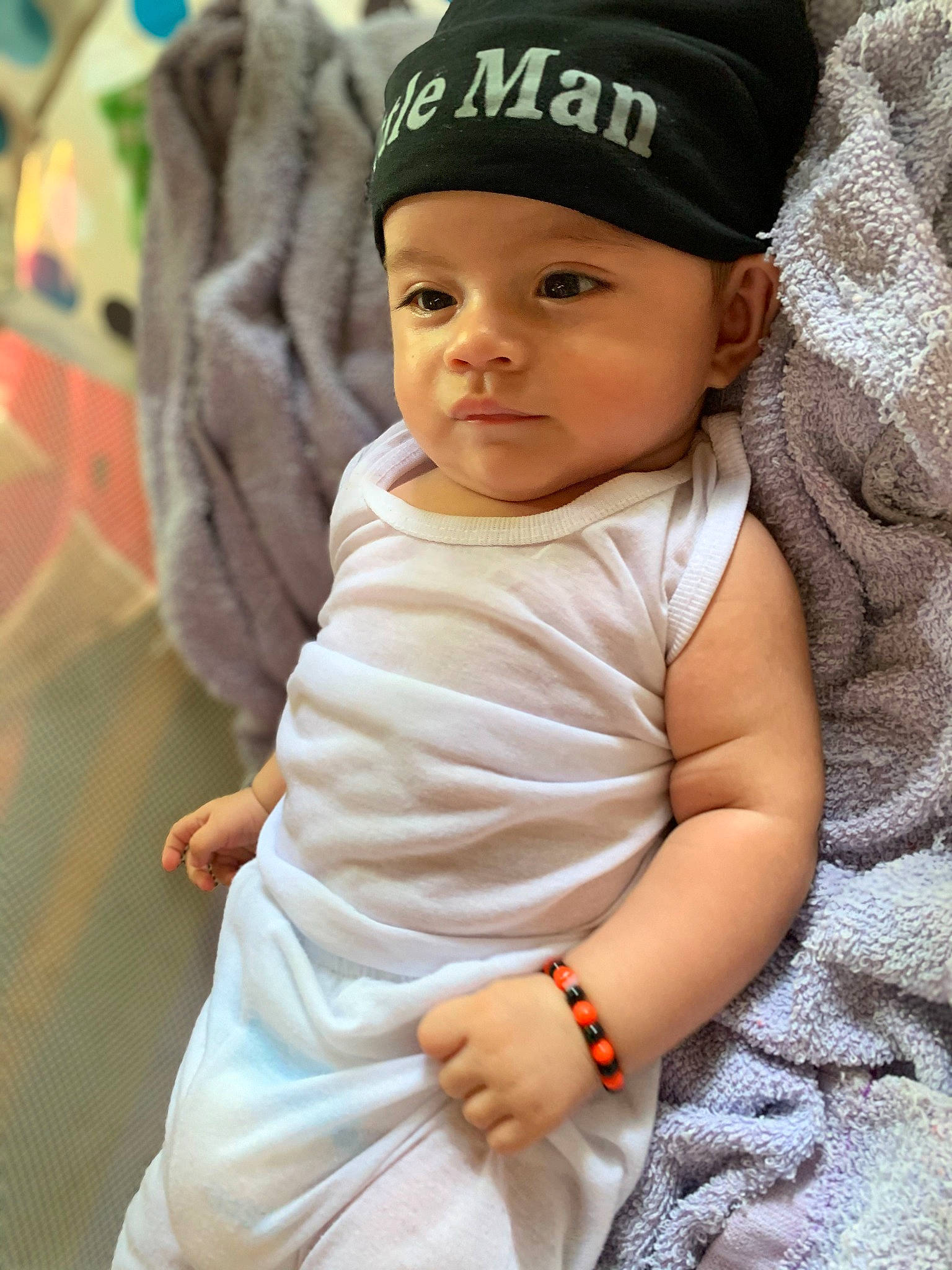 Angelo joined the competition — help win amazing prizes! baby, baby_toddler_clothing, baseball_cap, beanie, cap, cheek, child, fashion_accessory, fun, hand, happy, hat, headgear, headwear, knit_cap, linens, lip, person, sitting, sleeve