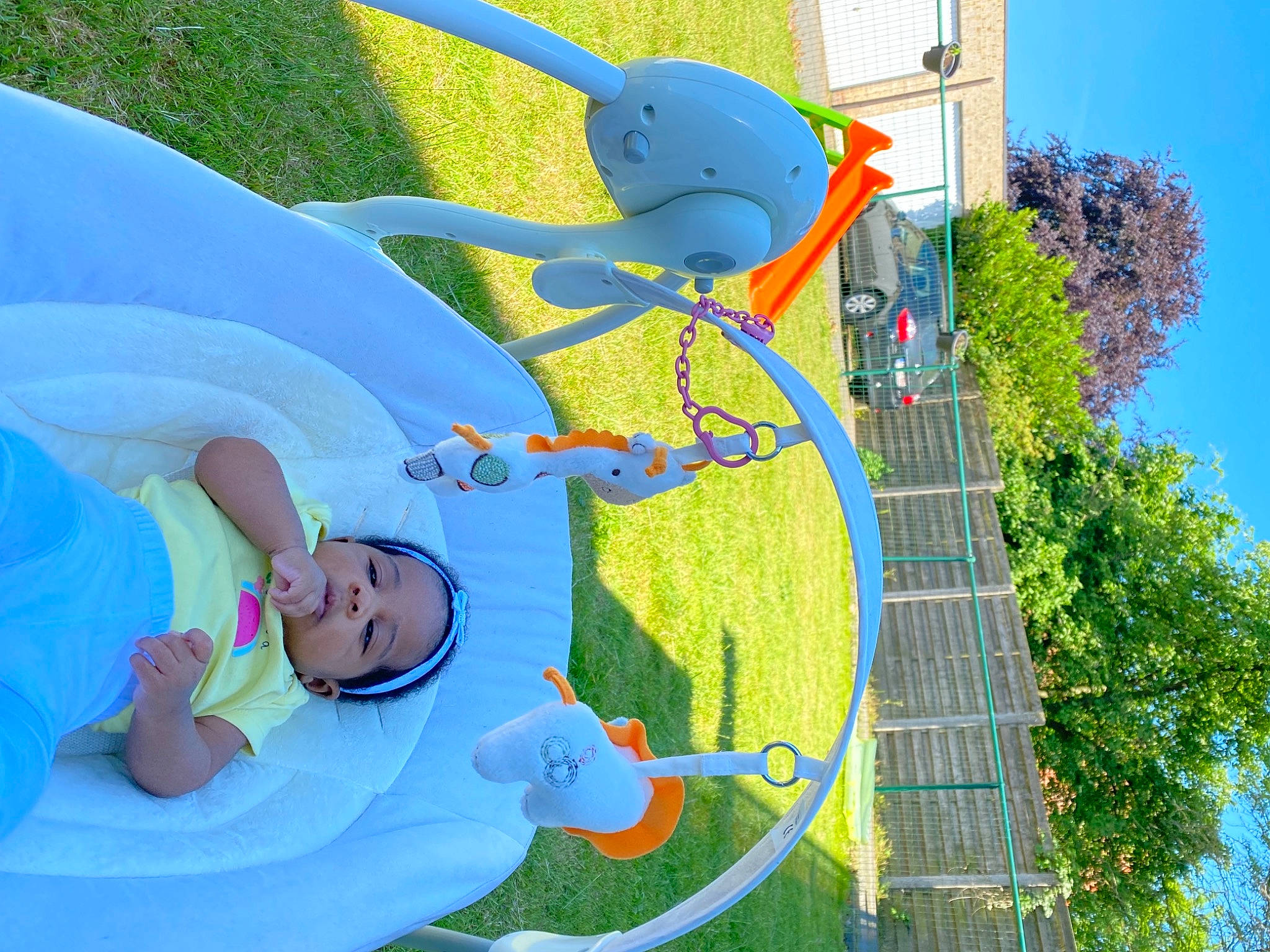 Cleo participe au concours pour gagner de l'argent avec cette photo : art, azure, baby, baby_toddler_clothing, blue, building, electric_blue, fun, grass, green, happy, hat, leisure, person, pole, recreation, sky, smile, toddler, tree