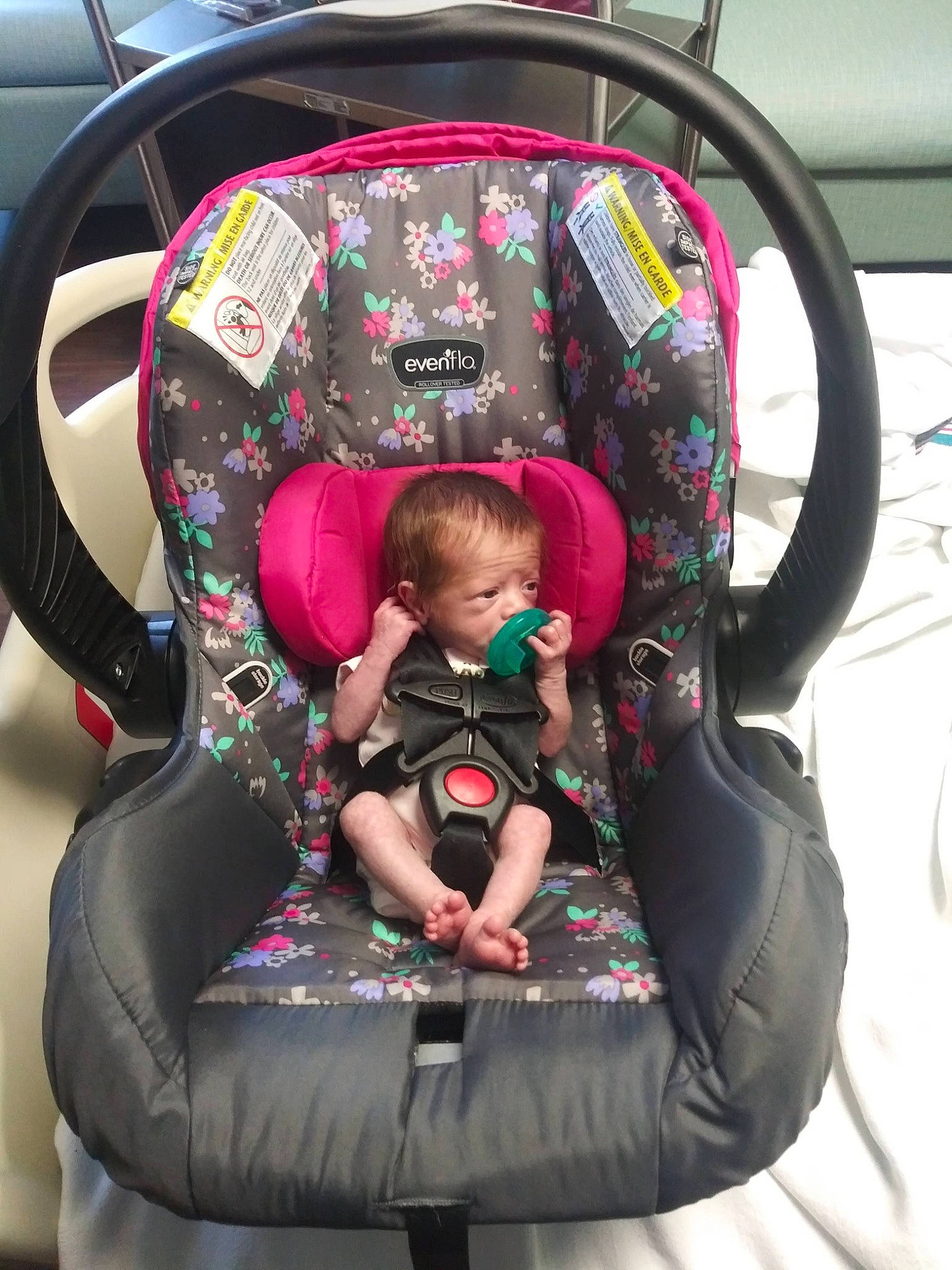 Phoebe is registered to the contest to win money with this photo: auto_part, automotive_design, automotive_tire, baby, baby_carriage, baby_products, baby_toddler_clothing, car_seat, child, comfort, design, fun, motor_vehicle, person, personal_protective_equipment, photograph, plant, recreation, steering_wheel, toddler