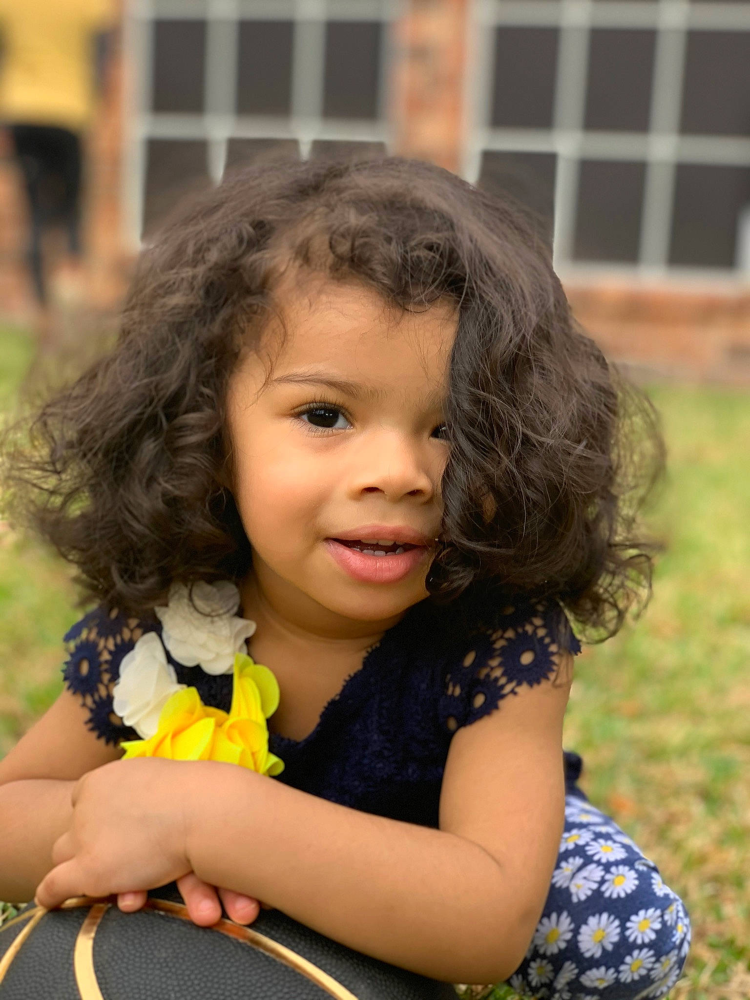 Bella joined the competition — help win amazing prizes! black_hair, child, child_model, fawn, grass, hair, hairstyle, happy, long_hair, person, skin, smile, toddler, yellow