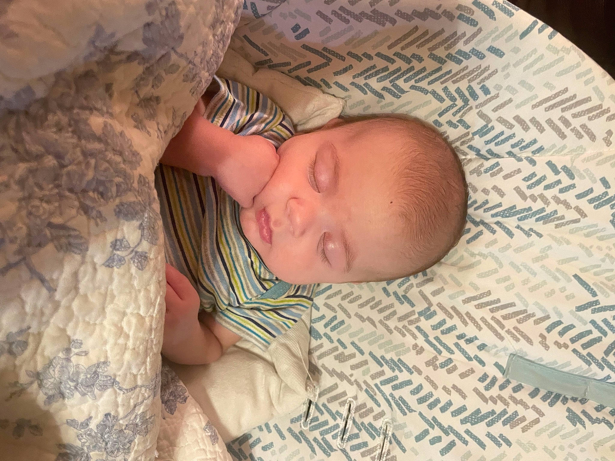 Abram joined the competition — help win amazing prizes! baby, baby_toddler_clothing, bedding, bedtime, blanket, child, comfort, flooring, grass, linens, military_camouflage, nap, pattern, person, room, skin, sleep, sleeve, textile, toddler