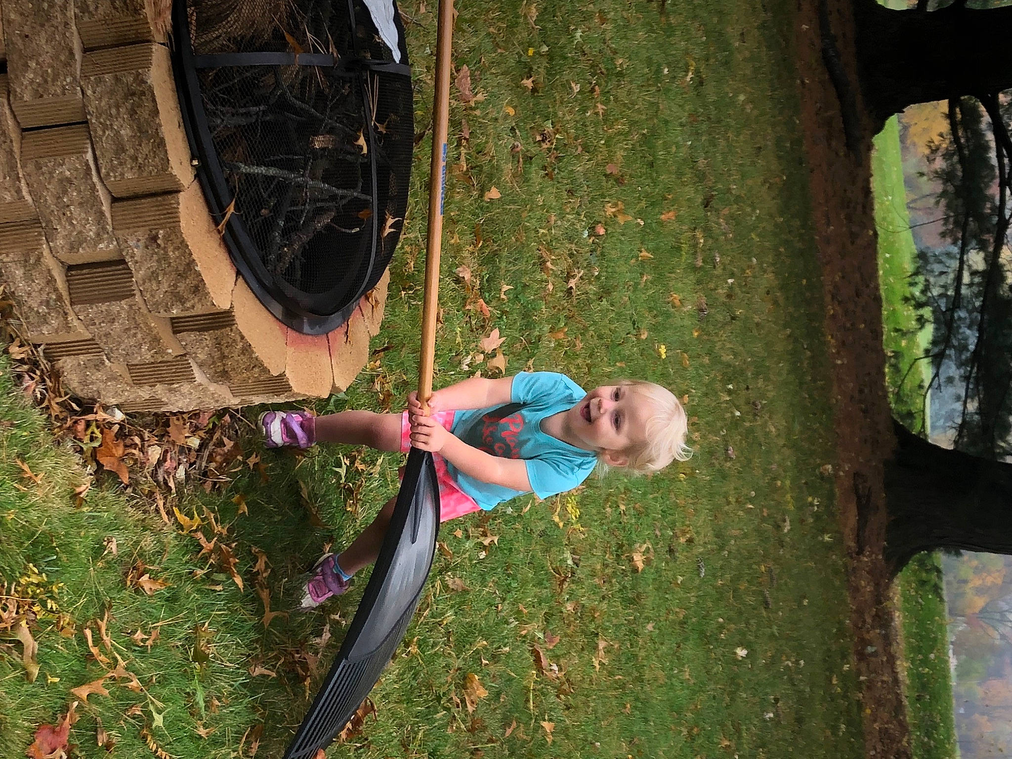 Genevieve is registered to the contest to win money with this photo: automotive_tire, automotive_wheel_system, circle, fun, grass, grass_family, happy, joy, landscape, lawn, leisure, people_in_nature, person, plant, shrub, tints_and_shades, tire, tree, trunk, wheel