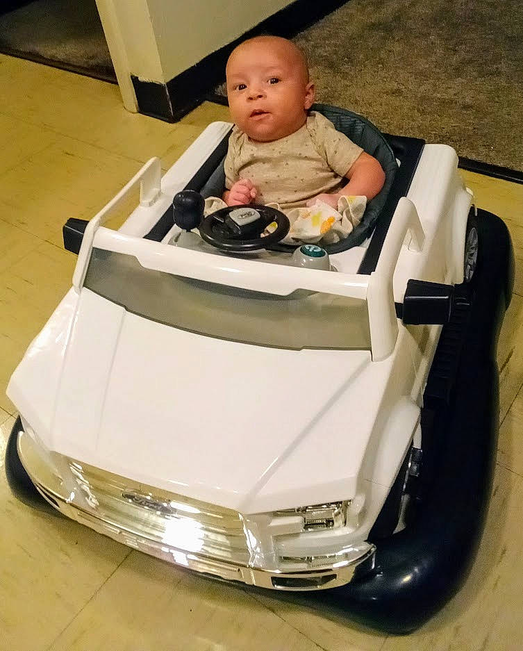 Jakobe is registered to the contest to win money with this photo: automotive_design, automotive_exterior, automotive_lighting, automotive_wheel_system, baby, baby_carriage, bumper, car, face, grille, head, headlamp, hood, motor_vehicle, person, personal_luxury_car, tire, toddler, vehicle, vehicle_door