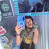 Dulce Vivian-Cortez joined the competition — help win amazing prizes! person, cat, mirror, selfie, phone, reflection, sticker, poster, indoor, bed, curtain, winking, beard, tattoo, casual_clothing, gray_cat, hand, bracelet, nose_ring, shorts