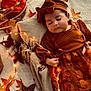 Anaïa a rejoint le concours — aidez-le/la à gagner de superbes lots ! autumn, baby, blanket, child, closeup, cozy, cute, decor, fairy_lights, fall_leaves, headband, infant, orange, peaceful, portrait, resting, seasonal, sleeping, soft_texture, warm_colors