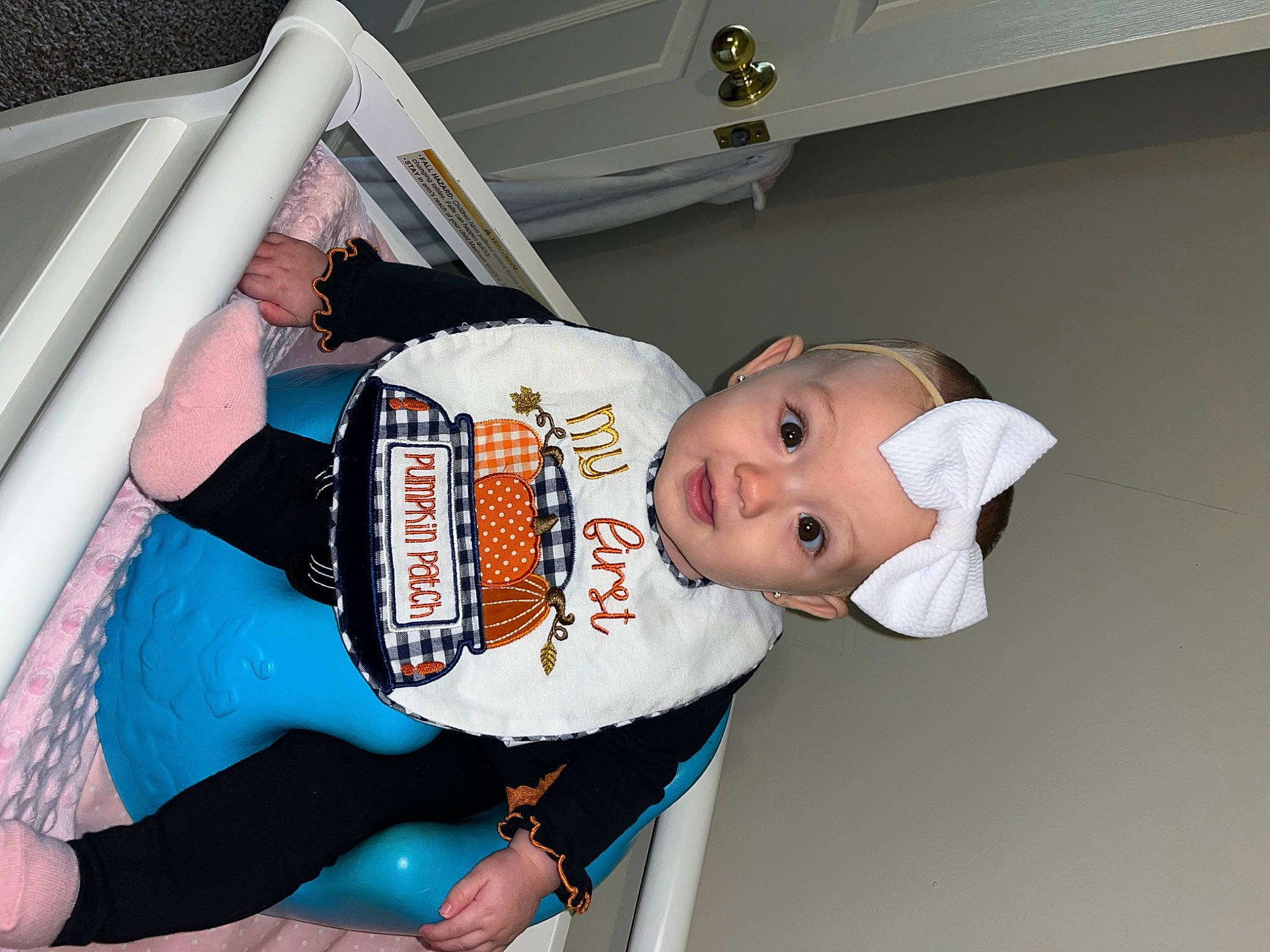 Ella is registered to the contest to win money with this photo: abdomen, baby, baby_products, baby_toddler_clothing, child, costume, event, family_car, fun, hat, human_leg, person, room, thigh, toddler, vehicle_door, waist