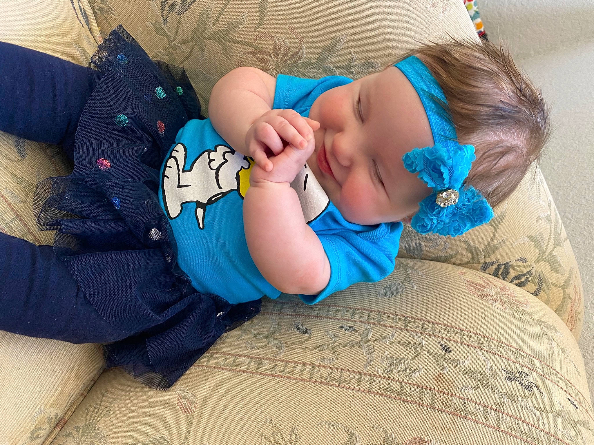 Harley is registered to the contest to win money with this photo: aqua, arm, azure, baby, baby_sleeping, baby_toddler_clothing, child, comfort, cool, electric_blue, finger, happy, headwear, linens, pattern, person, skin, sleeve, t_shirt, textile