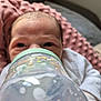 baby, blanket, bottle, child, closeup, cute, drink, eyes, face, feeding, indoors, infant, milk, newborn, person, pink, resting, soft_texture, white_clothing, young
