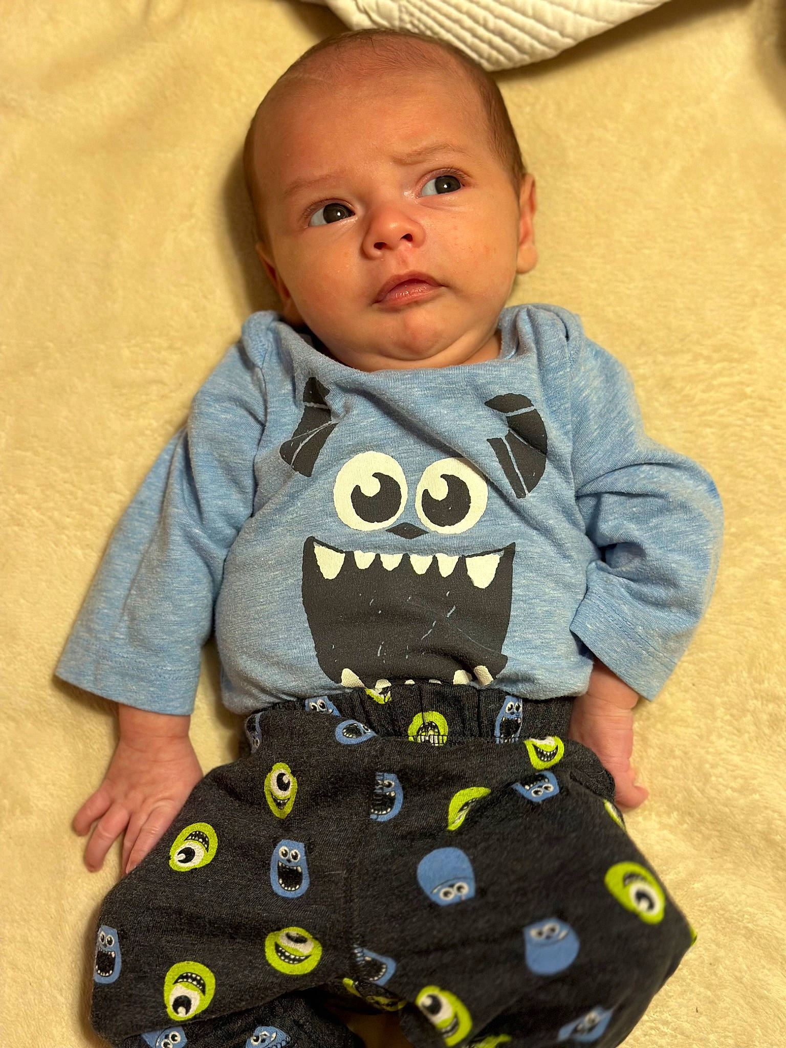 Keelan is registered to the contest to win money with this photo: arm, art, baby, baby_products, baby_toddler_clothing, cheek, child, comfort, face, flooring, happy, head, human_body, long_sleeved_t_shirt, pattern, person, polka_dot, sitting, sleeve, t_shirt