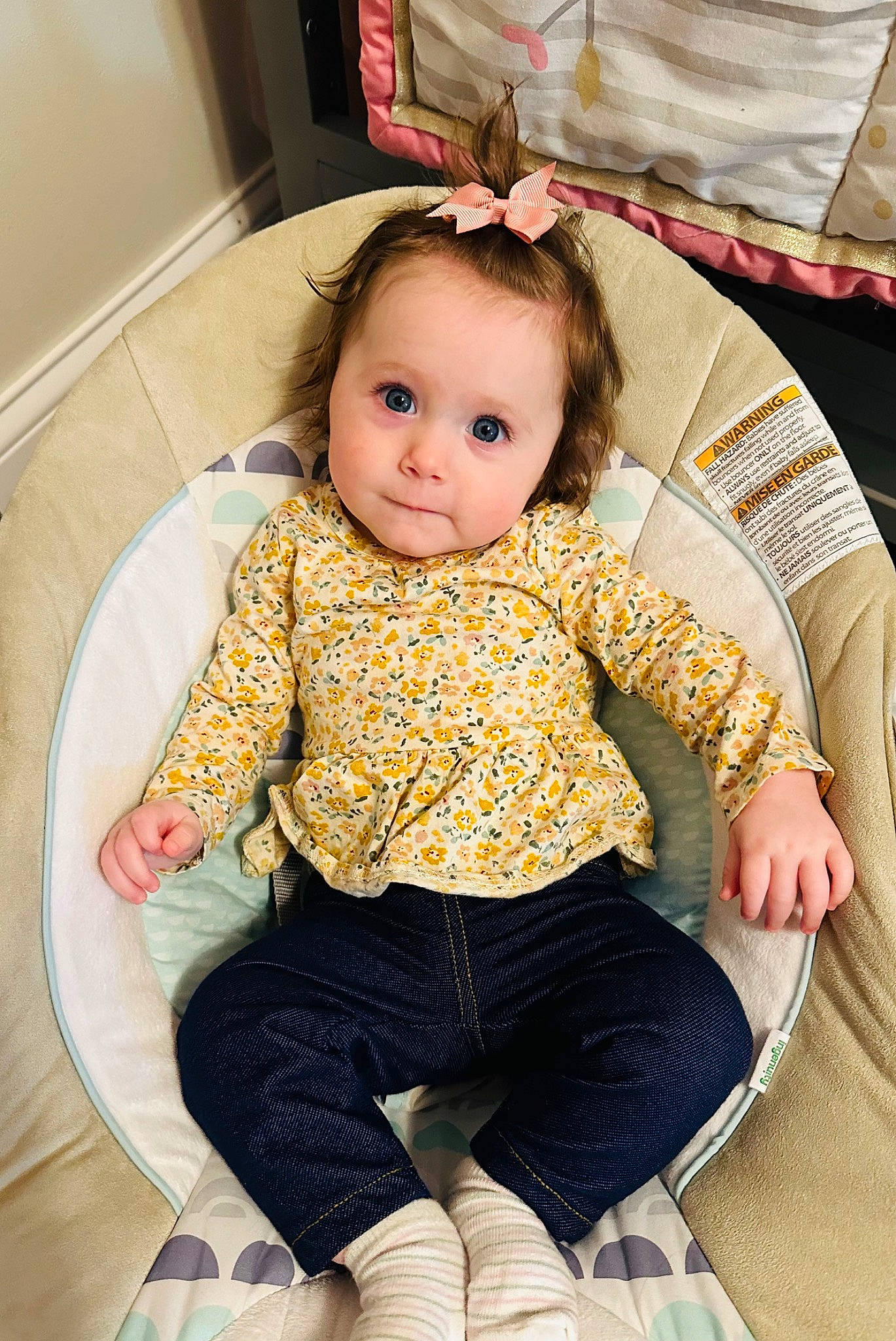 Kaliyah is registered to the contest to win money with this photo: baby, baby_products, baby_toddler_clothing, chair, cheek, child, comfort, eye, face, fun, happy, human_leg, knee, lap, leg, person, sitting, sleeve, sock, thigh