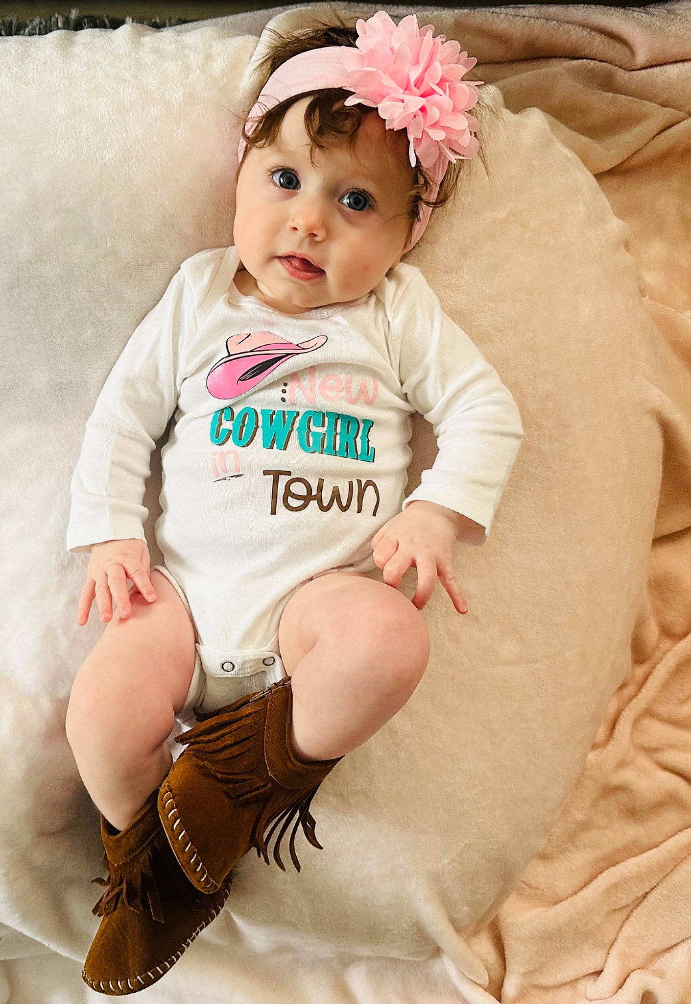 Kaliyah is registered to the contest to win money with this photo: baby, baby_toddler_clothing, child, eye, fashion_accessory, hair_accessory, happy, head, headband, headpiece, headwear, human_leg, jewellery, pattern, person, pink, skin, sleeve, sock, thigh