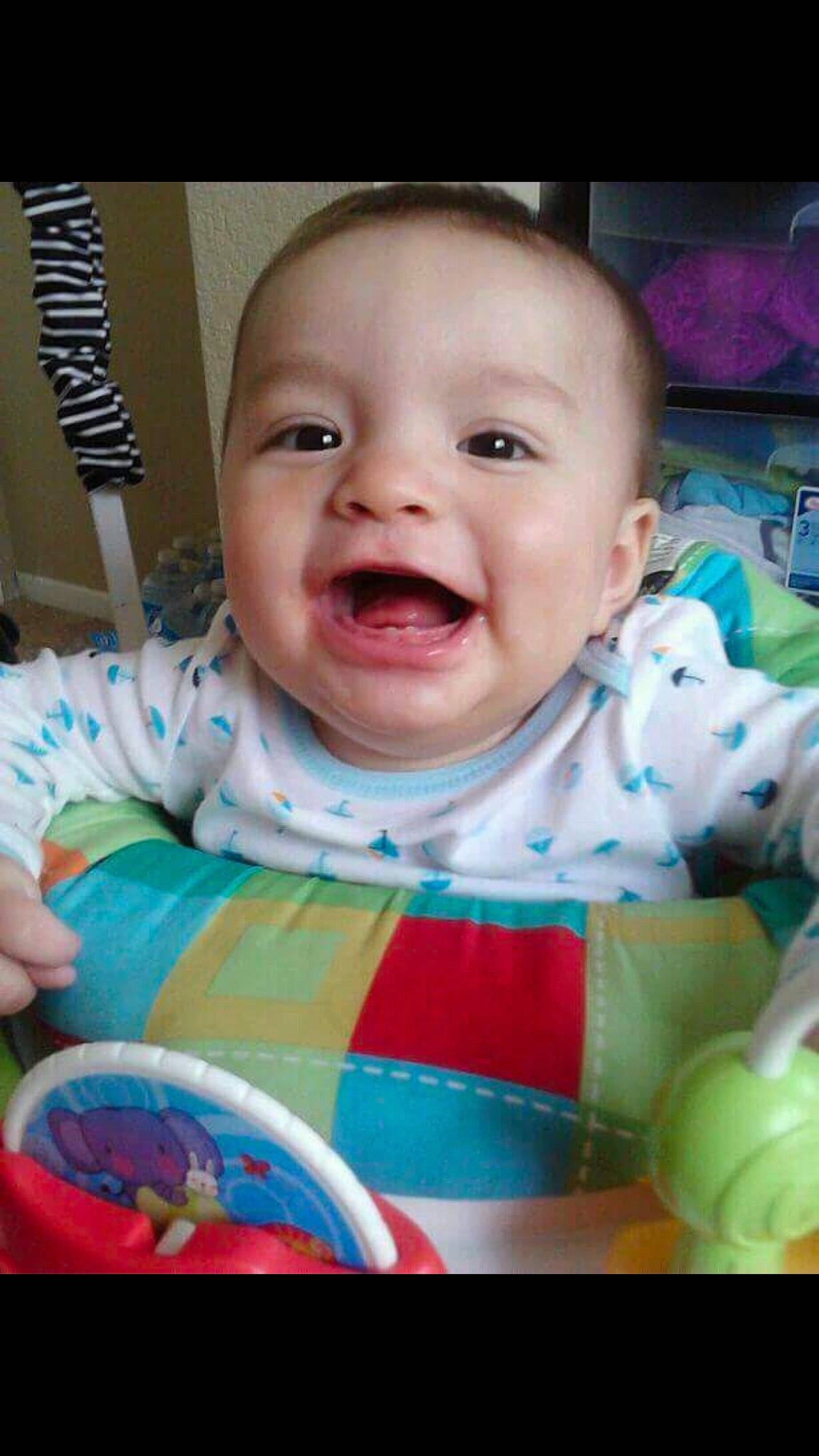 Adam is registered to the contest to win money with this photo: baby, baby_laughing, baby_products, baby_toddler_clothing, bib, cheek, child, dress, face, facial_expression, fun, happy, iris, mouth, nose, person, pink, product, skin, smile