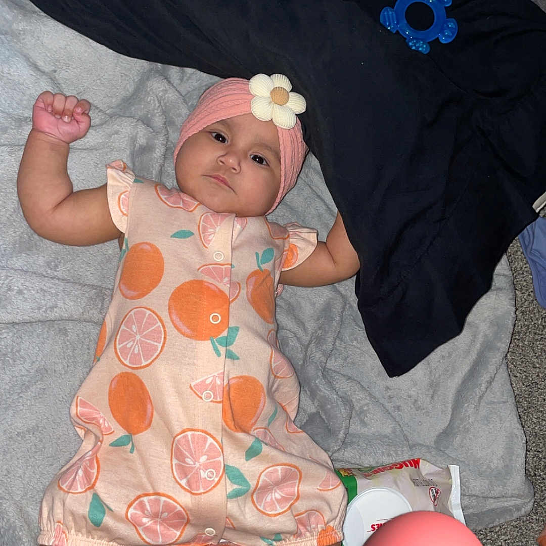 Avellana joined the competition — help win amazing prizes! baby, blanket, carpet, child, clothing, cute, floor, flower, headband, heart_emoji, indoors, infant, lying_down, peach_pattern, pink, playtime, socks, soft_texture, toy, white_socks
