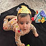 Avellana joined the competition — help win amazing prizes! baby, child, headband, toy, colorful, crawling, blanket, carpet, animal_print, pajamas, indoor, floor, infant, play, cute, hand, face, person, soft_toy, pattern