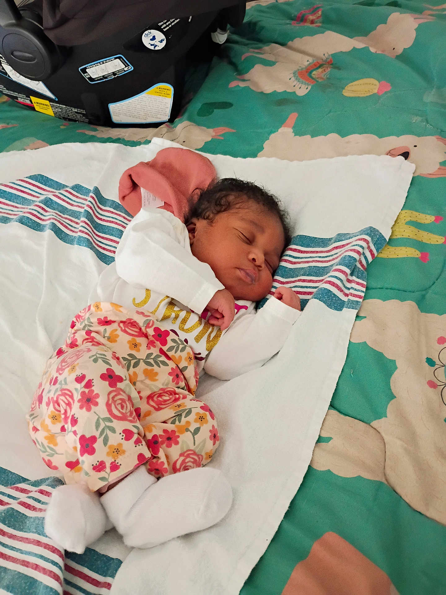 Aviana joined the competition — help win amazing prizes! baby, sleeping, blanket, floral_pants, white_socks, car_seat, indoor, child, cute, resting, infant, person, soft, comfortable, patterned_blanket, peaceful, newborn, nap, lying_down, cozy