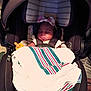 Aviana joined the competition — help win amazing prizes! baby, car_seat, blanket, bottle, sleeping, infant, child, seatbelt, headband, pink_bow, striped_blanket, indoors, cute, peaceful, resting, cloth, safety, person, young_child, transportation