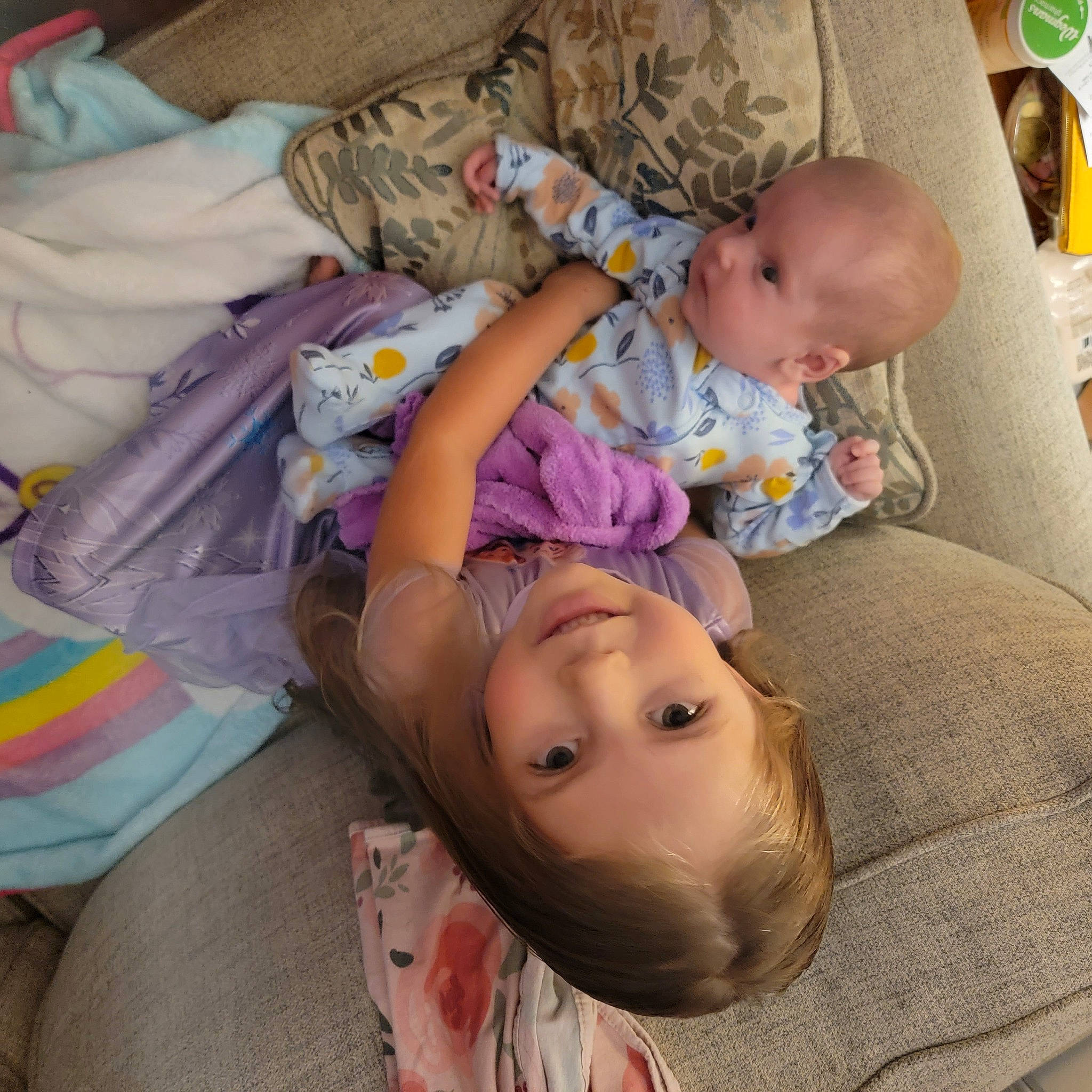 Layla is registered to the contest to win money with this photo: baby, baby_products, baby_toddler_clothing, bedtime, cheek, child, comfort, flooring, fun, happy, joy, lap, nap, person, purple, room, sitting, skin, sleep, toddler