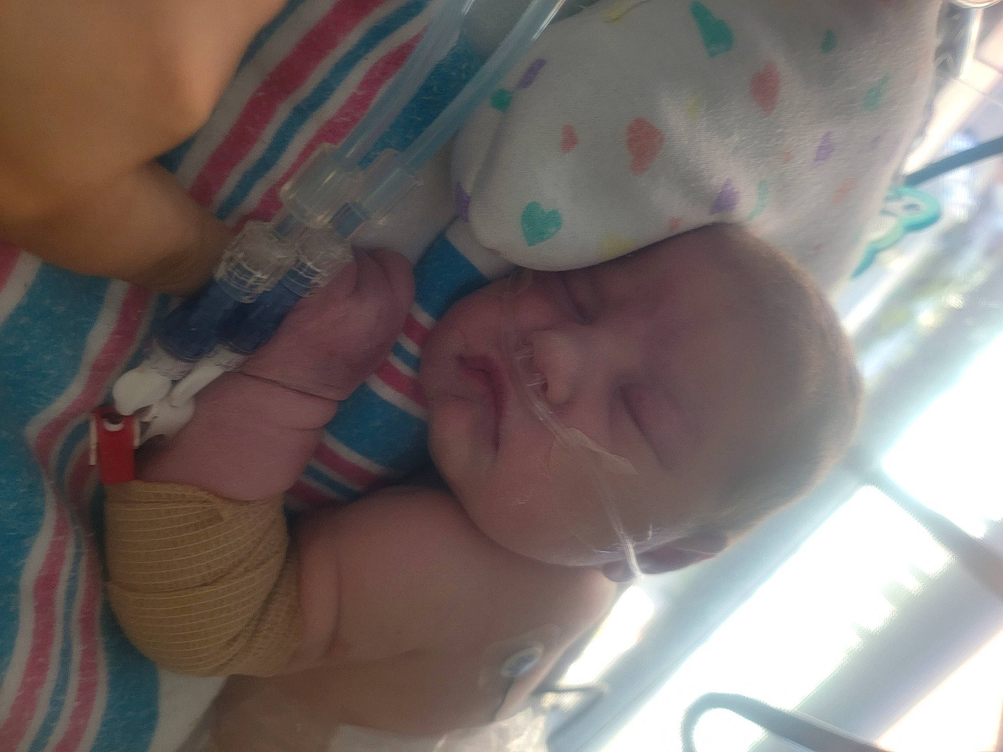 Layla is registered to the contest to win money with this photo: baby, baby_toddler_clothing, cheek, chest, chin, comfort, eyebrow, finger, gesture, hand, human_body, iris, lip, mouth, muscle, nail, nose, person, skin, thumb