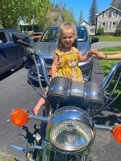 Kaliyah is registered to the contest to win money with this photo: alloy_wheel, automotive_design, automotive_exterior, automotive_lighting, automotive_tire, car, fuel_tank, headlamp, hood, jeans, joy, land_vehicle, mode_of_transport, motor_vehicle, person, plant, rim, tire, tree, vehicle