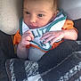 Adam participe au concours pour gagner de l'argent avec cette photo : baby, bib, blanket, car_seat, child, comfort, cozy, cushion, cute, face, hand, indoors, infant, newborn, orange_clothing, portrait, resting, sleepwear, soft_light, young_child