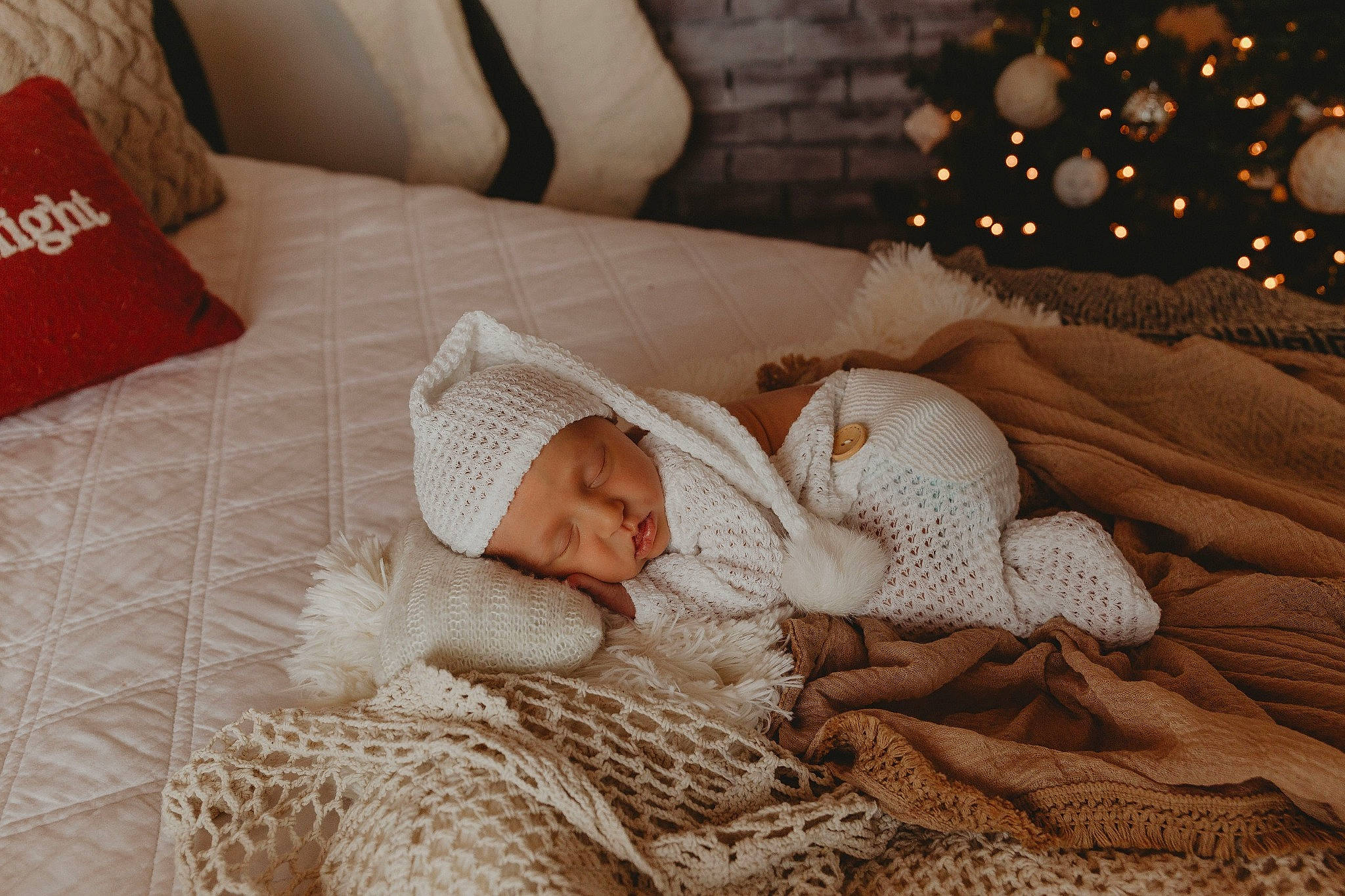 Teagan joined the competition — help win amazing prizes! baby, bed_sheet, bedding, child, comfort, couch, event, fur, furniture, hat, head, headwear, linens, pattern, person, room, throw_pillow, toddler, tradition, tree