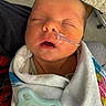 Addisyn joined the competition — help win amazing prizes! newborn, baby, sleeping, blanket, pacifier, nasal_tube, medical, infant, closeup, face, person, child, hospital, care, resting, wrapped, cute, indoors, soft, peaceful
