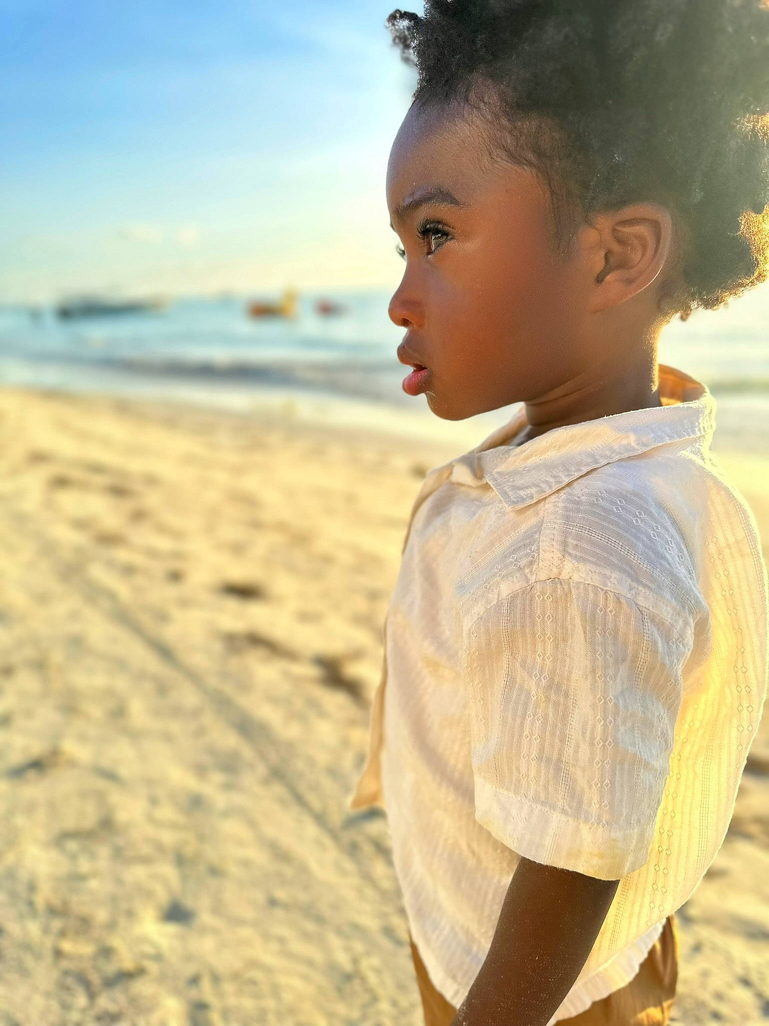 Luka is registered to the contest to win money with this photo: beach, child, cloud, eye, face, flash_photography, fun, happy, horizon, landscape, ocean, people_in_nature, people_on_beach, person, sand, sky, toddler, travel, water, wind_wave