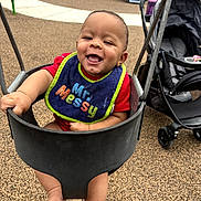 Zander joined the competition — help win amazing prizes! baby, bib, child, clothing, daylight, equipment, feet, fun, happy, infant, outdoor, park, person, play, playground, recreation, seat, smiling, stroller, swing