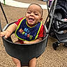 baby, swing, playground, smiling, bib, stroller, outdoor, child, happy, infant, seat, play, fun, park, feet, person, clothing, daylight, recreation, equipment