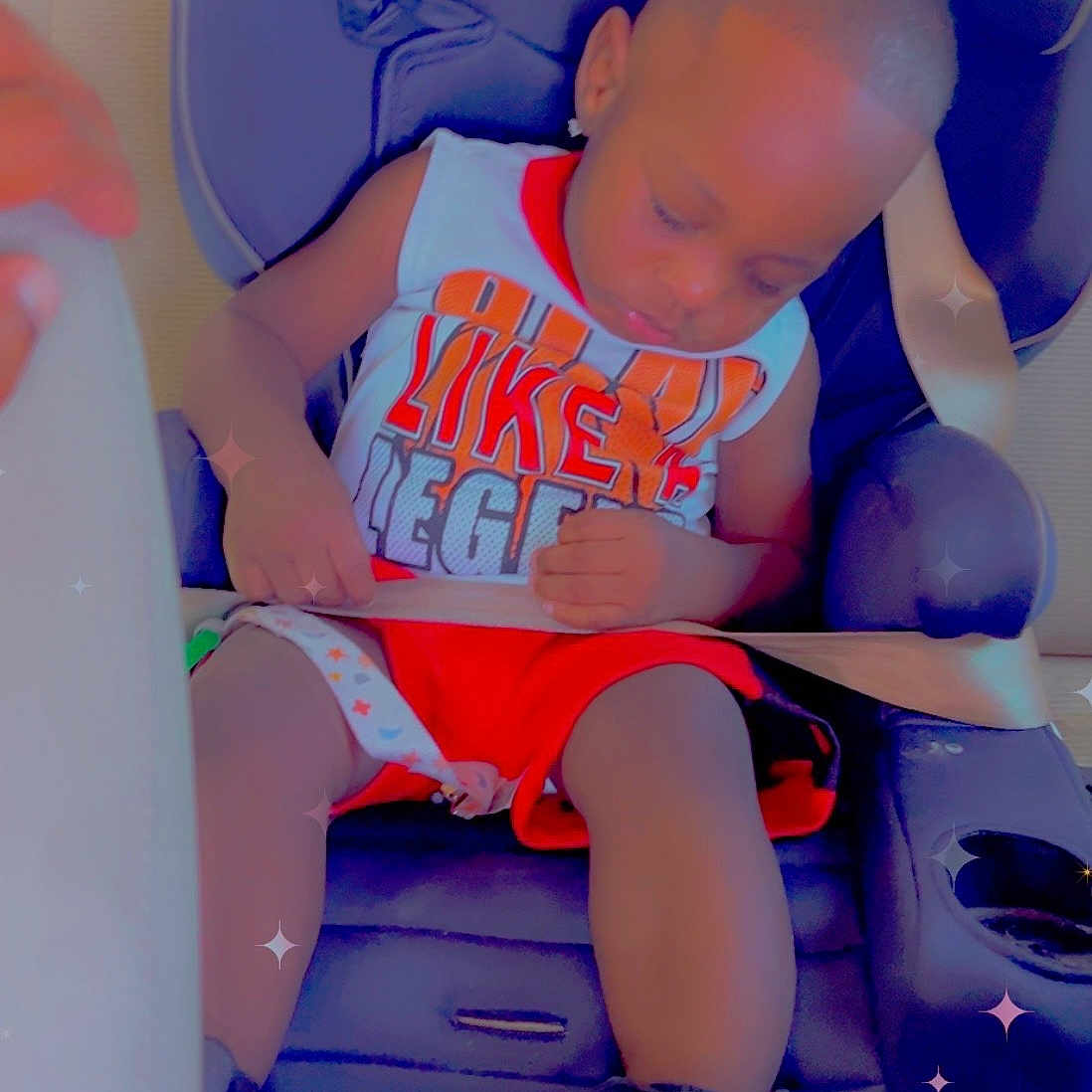 Christian is registered to the contest to win money with this photo: toddler, child, car_seat, sleeping, seatbelt, sneakers, clothing, indoor, baby, resting, nap, vehicle, seat, footwear, cute, infant, safety, colorful, casual, peaceful