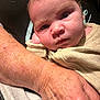 arm, baby, closeup, clothing, contrast, elderly, expression, face, hand, human, indoor, infant, newborn, person, portrait, resting, skin, skin_texture, warmth, wrinkles