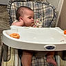Aurora is registered to the contest to win money with this photo: baby, high_chair, sleeping, plaid, infant, child, indoors, furniture, foot, hand, resting, cute, peaceful, toddler, face, person, clothing, skin, head, seat