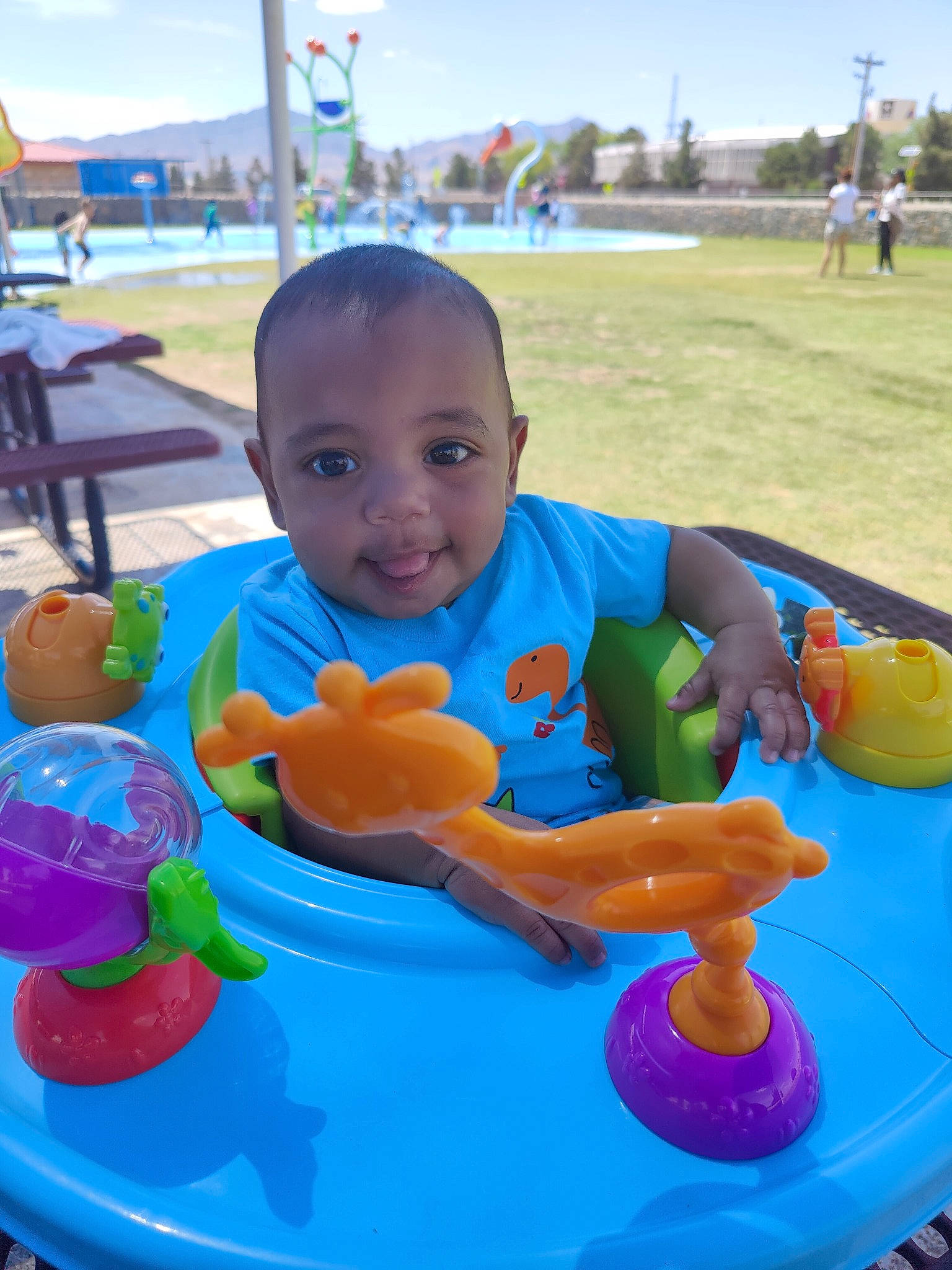 Kaylen is registered to the contest to win money with this photo: baby, baby_playing_with_toys, baby_toddler_clothing, blue, child, city, fun, grass, happy, leisure, outdoor_recreation, person, play, product, recreation, shorts, sitting, sky, t_shirt, toddler