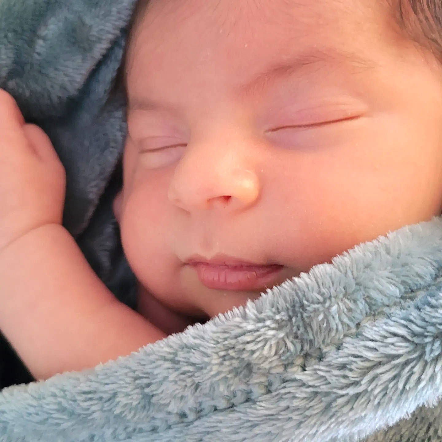 Luis is registered to the contest to win money with this photo: baby, baby_sleeping, cheek, chin, comfort, ear, eyebrow, eyelash, finger, gesture, grass, hand, happy, headwear, lip, mammal, mouth, nose, person, skin