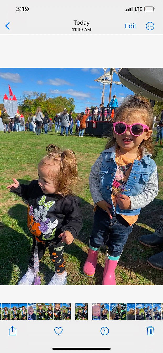 Juliet is registered to the contest to win money with this photo: child, event, eyewear, flag, fun, goggles, grass, grassland, happy, landscape, leisure, person, plant, pole, recreation, sky, sneakers, sunglasses, toddler, tree