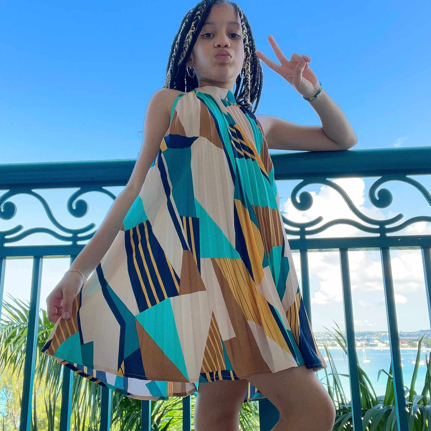 Zoe is registered to the contest to win money with this photo: accessories, adult, beachwear, blackhair, bracelet, braid, clothing, cornrows, dress, face, female, hair, head, jewelry, person, racket, sleeve, woman