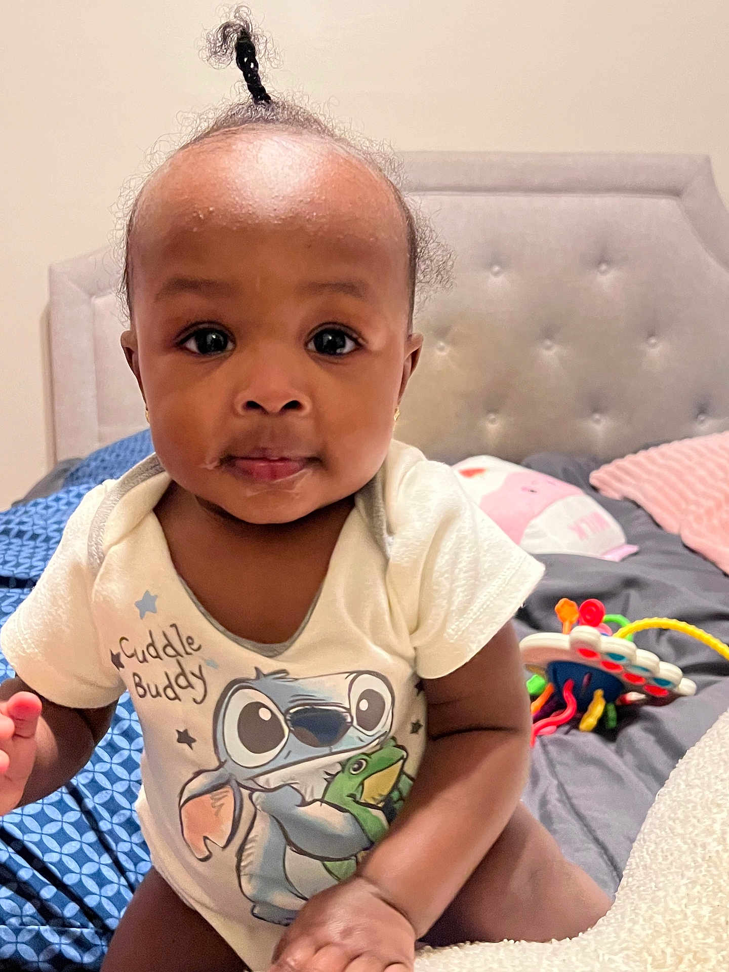 Reign joined the competition — help win amazing prizes! baby, bed, cartoon, child, clothing, cute, expression, face, hair, hand, head, indoor, infant, onesie, person, pillow, skin, smile, topknot, toy