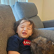 Richie joined the competition — help win amazing prizes! casual, child, clothing, couch, cozy, cute, face, furniture, hair, happy, indoor, levis, living_room, person, plush, portrait, relaxed, sitting, smiling, toddler