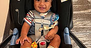 Landon joined the competition — help win amazing prizes! baby, baby_feet, car_seat, carpet, child, happy, harness, indoor, infant, looking_at_camera, pacifier, photography, portrait, safety_harness, seated, smile, smiling, socks, striped_shirt, toy