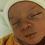 Nalia participe au concours pour gagner de l'argent avec cette photo : baby, sleeping, hat, orange_clothing, close_up, face, infant, peaceful, child, knitwear, soft, newborn, portrait, cute, young, resting, indoors, headwear, cozy, skin