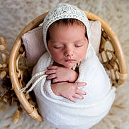 Aaron participe au concours pour gagner de l'argent avec cette photo : newborn, baby, sleeping, wrapped, blanket, knit, bonnet, basket, wicker, cozy, soft, peaceful, infant, cute, hands, closed_eyes, portrait, indoor, warm, cushion