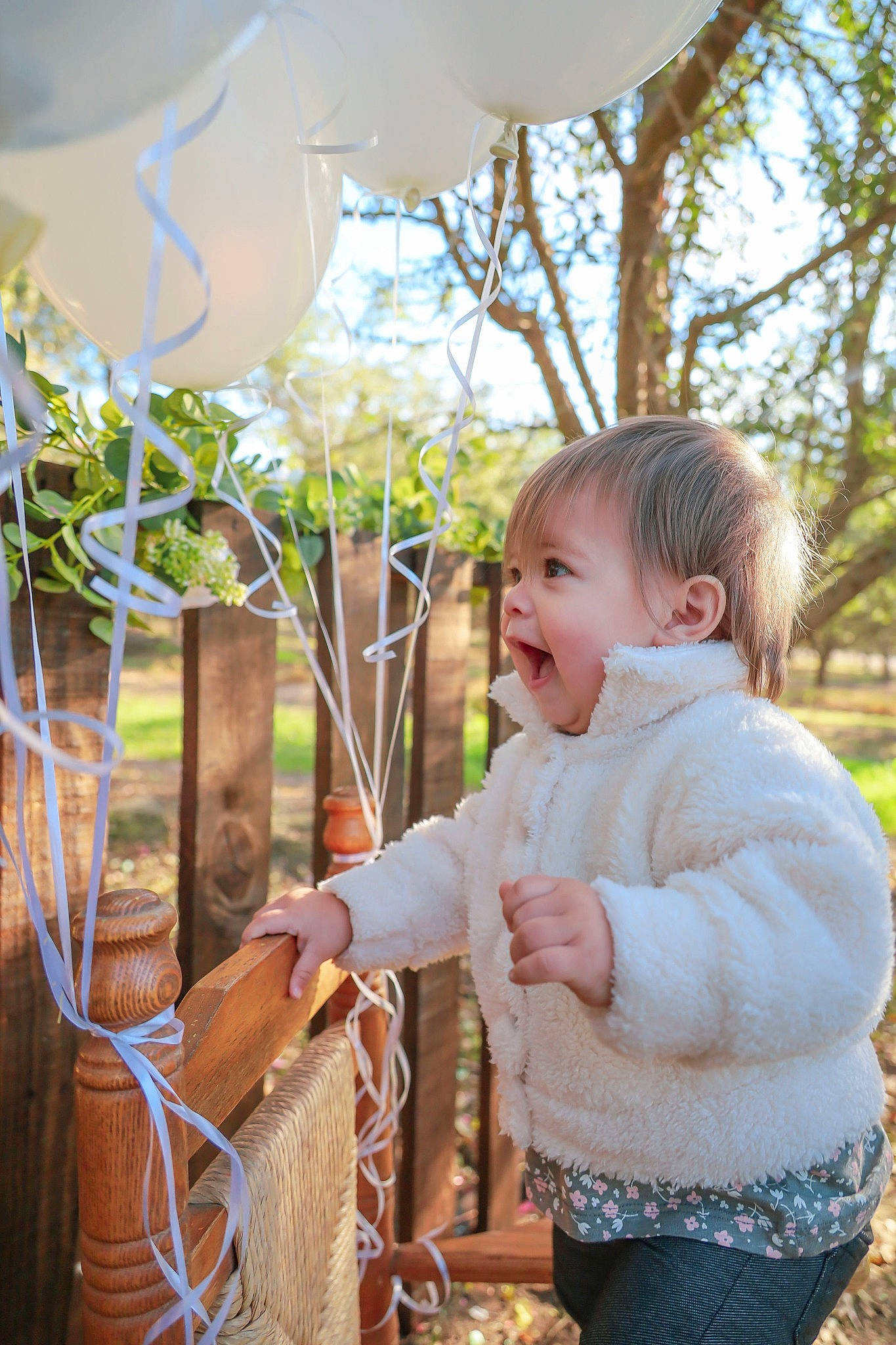 Braelyn joined the competition — help win amazing prizes! baby, baby_toddler_clothing, basket, child, fun, grass, happy, hoodie, leisure, pattern, people_in_nature, person, plant, rope, smile, storage_basket, toddler, tree, twig, wicker