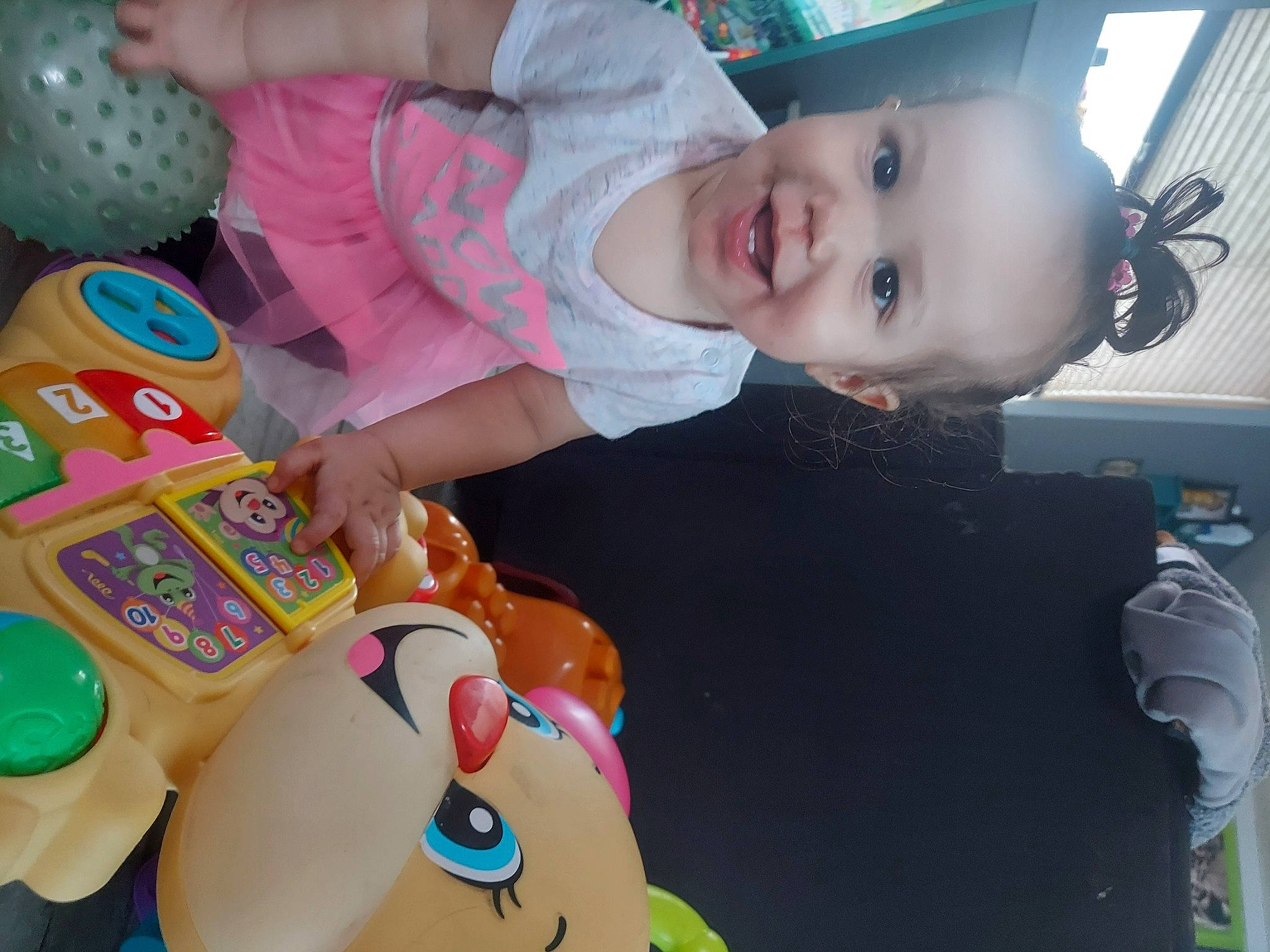 Brynlee is registered to the contest to win money with this photo: baby, baby_playing_with_toys, baby_products, baby_toddler_clothing, baby_toys, cheek, child, fun, happy, joy, mouth, organ, person, pink, play, product, room, skin, smile, snapshot