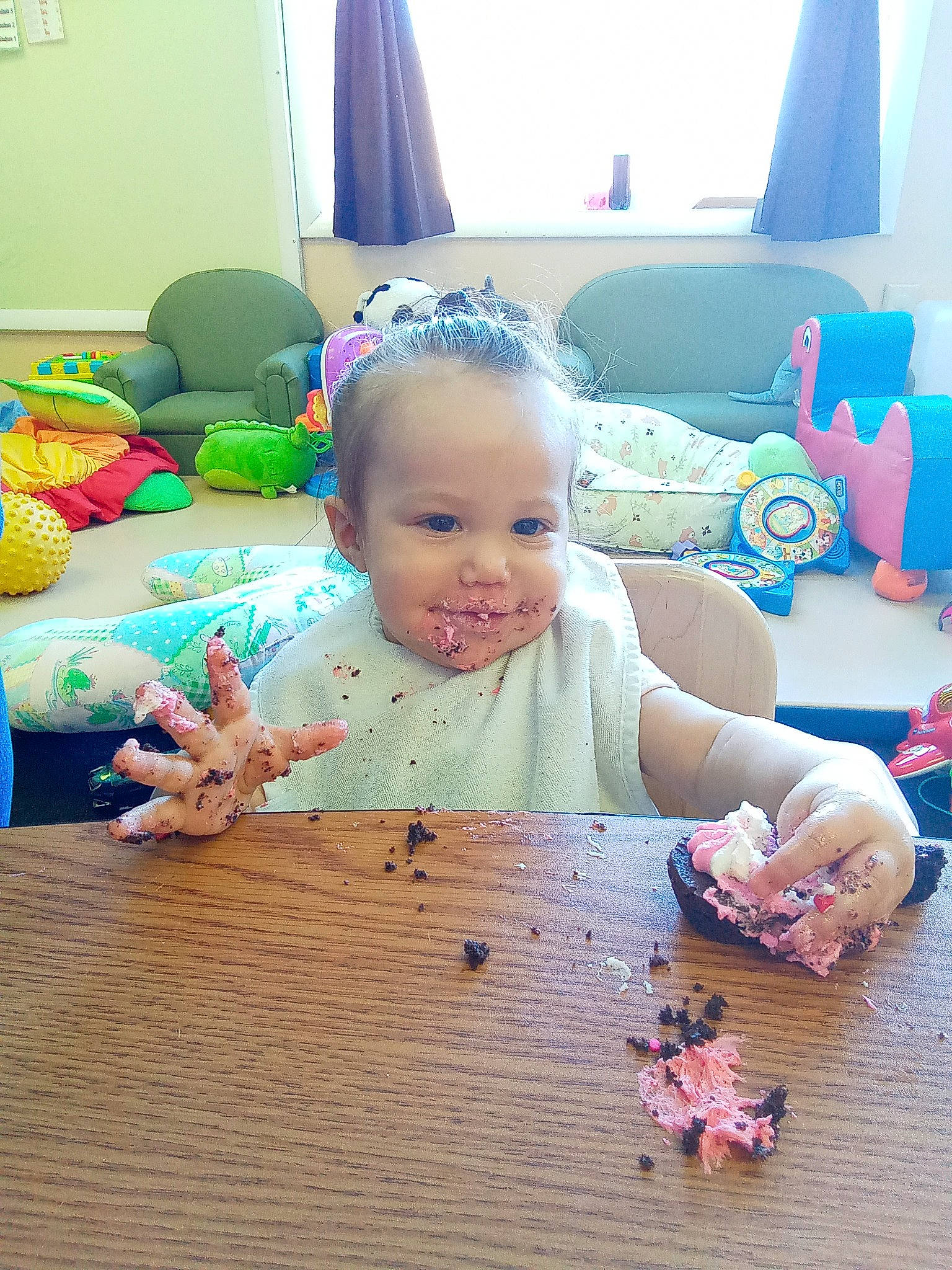 Brynlee joined the competition — help win amazing prizes! baby, baby_toddler_clothing, blue, cheek, child, couch, event, flooring, fun, happy, hardwood, person, picture_frame, pink, sitting, skin, smile, toddler, toy, window