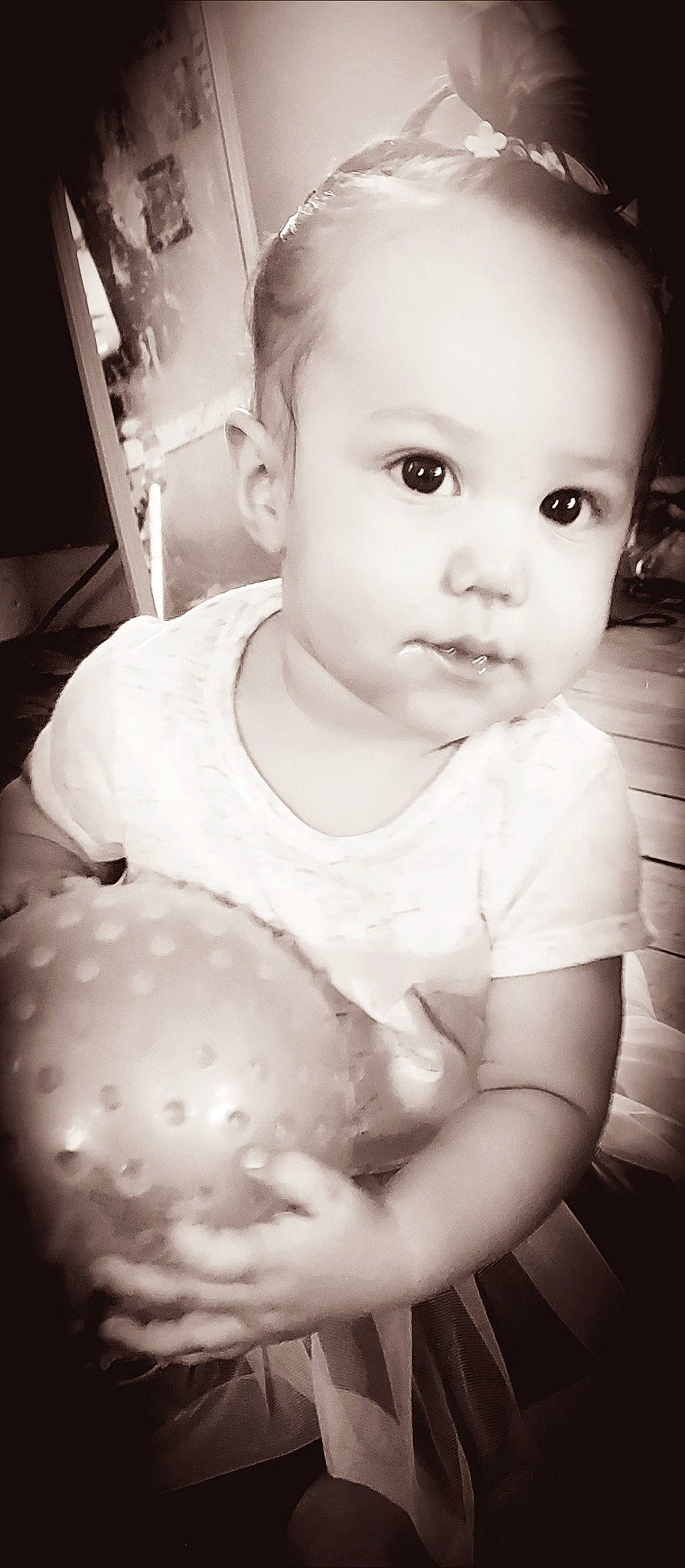 Brynlee is registered to the contest to win money with this photo: arm, baby, baby_toddler_clothing, black, black_and_white, cheek, flash_photography, gesture, hand, happy, human, human_body, iris, lip, nose, organ, person, skin, sleeve, standing