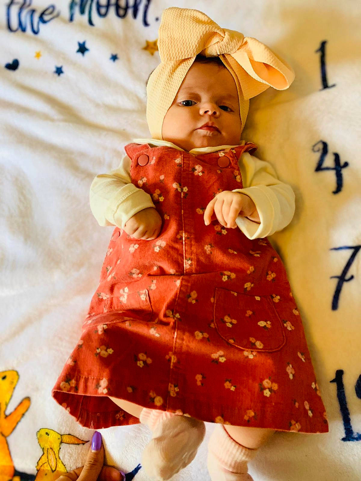 Giulia is registered to the contest to win money with this photo: baby_toddler_clothing, child, day_dress, doll, dress, fashion_design, happy, hat, one_piece_garment, orange, outerwear, pattern, peach, person, ruffle, sleeve, sun_hat, thigh, toddler, toy